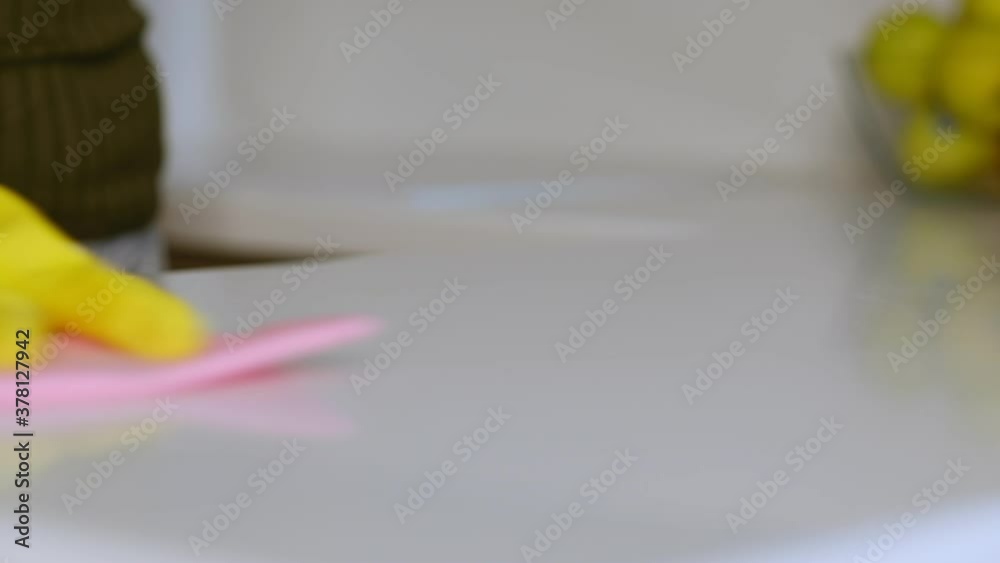 hand with rubber glove cleaning table with sponge and detergent. hand with rubber glove cleaning table with sponge and detergent hand with rubber glove cleaning table with sponge and detergent. hand with rubber glove cleaning table with sponge and detergent