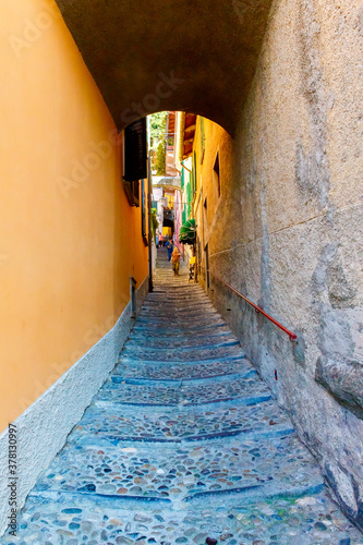 Varenna, lake Como, Italy September 20, 2019. Unknown people on a street in Varenna, a small town on lake Como, Italy © frolova_elena
