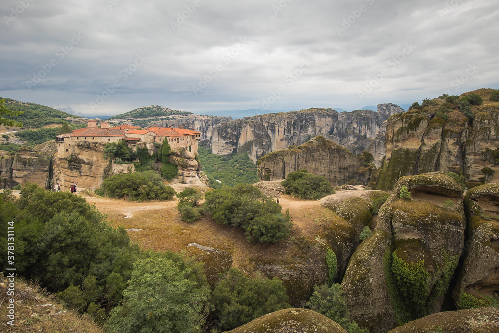 Drone Panorama of Varlaam Monastery. Beautiful scenic panoramic view, ancient traditional greek building on the top of huge stone pillar in Meteora,Thessaly, Greece, Europe on a cloudy day. Drone Panorama of Varlaam Monastery. Beautiful scenic panoramic view, ancient traditional greek building on the top of huge stone pillar in Meteora,Thessaly, Greece, Europe on a cloudy day.