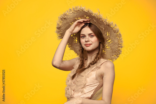 Lady in a hat and dress red hair yellow background model portrait fun