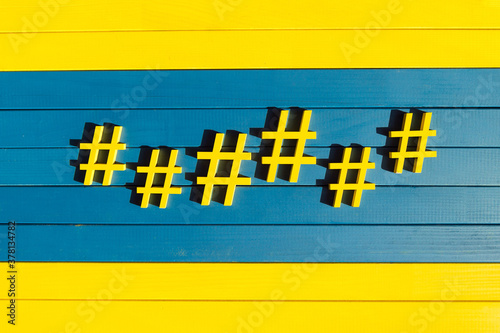 Yellow hashtags on the blue background