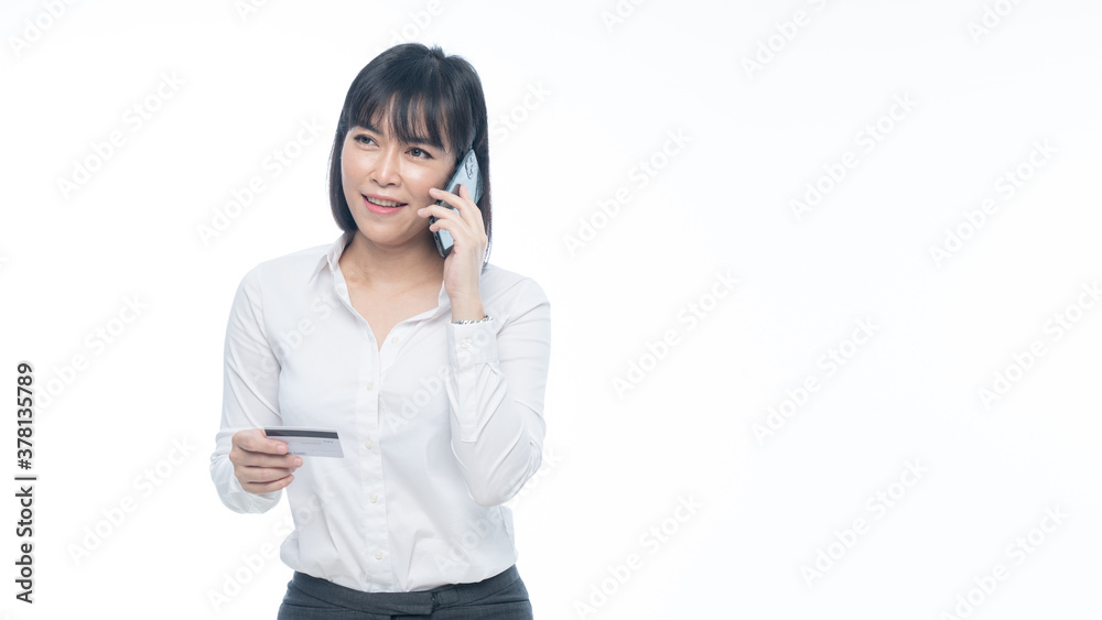 Working woman using credit card on smartphone Working woman using credit card on smartphone
