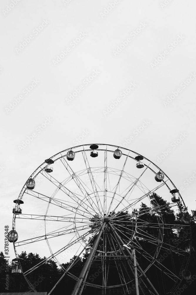 Urban geometry, modern architecture, Abstract and Inspirational architectural design.Ferris wheel in an amusement Park. Monochrome photography