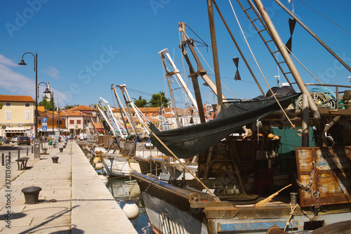 Old fishing boat in the harbor of seaside resort Novigrad (Cittanova) in Istria, Croatia