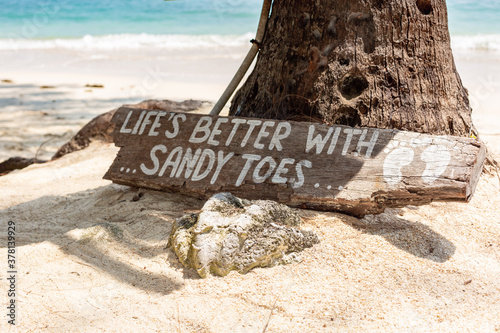 wooden sign sandy toes at a beach in Thailand Ko Samui photo