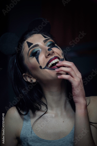 Girl with scary killer clown makeup to celebrate halloween