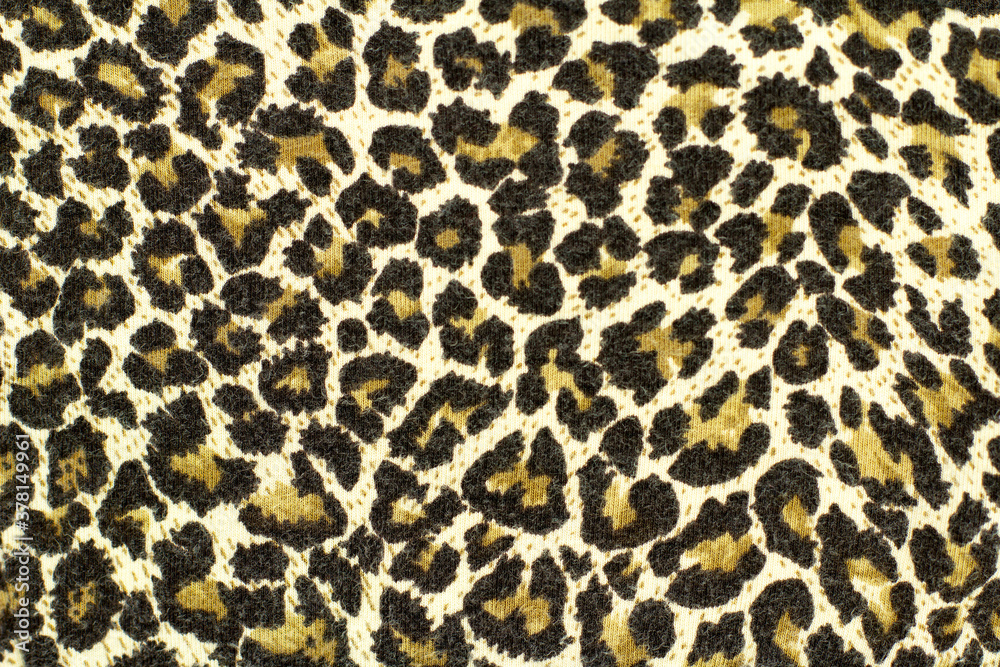 Texture of speckled leopard fabric. Wildlife animal background Texture of speckled leopard fabric. Wildlife animal background