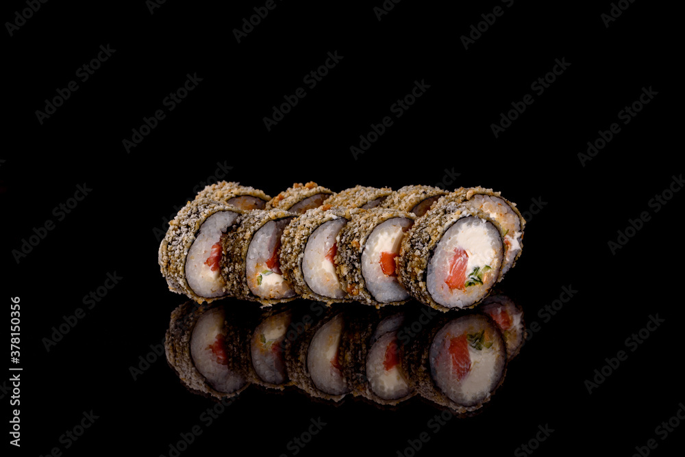 Fresh delicious beautiful sushi rolls on a dark background Fresh delicious beautiful sushi rolls on a dark background