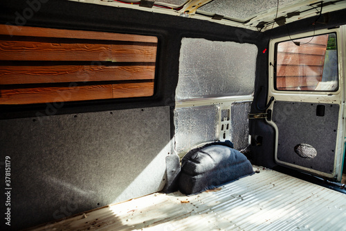 Conversion of a t4 van into a camper van.. Carpeting has been added to the metalwork.