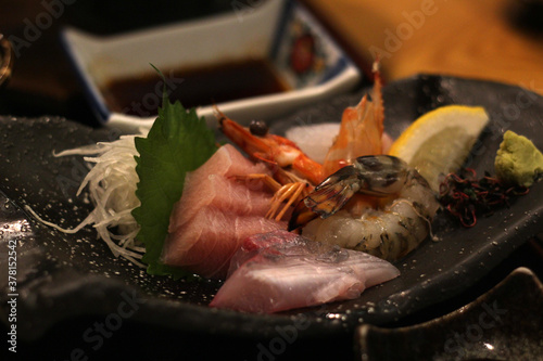 Close up of a plate of delicious sashima (raw fish), Japanese food, soft focus