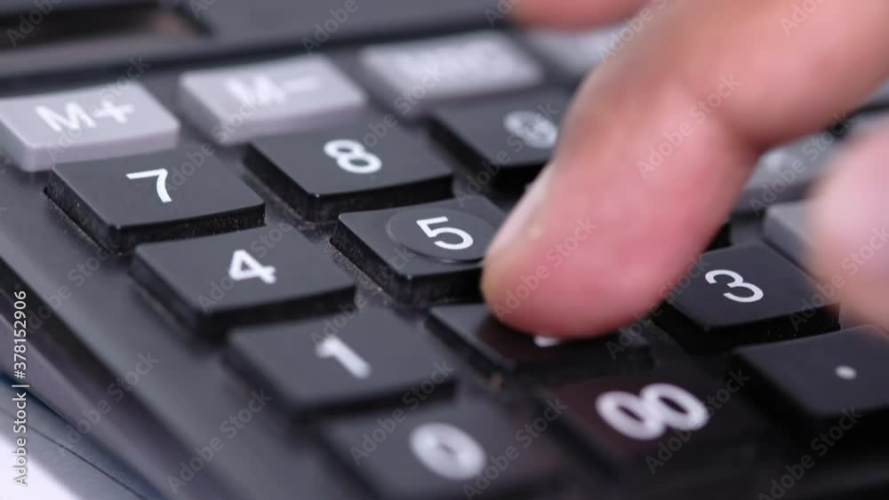 Close up of man hand using calculator Close up of man hand using calculator