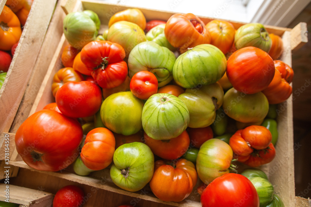 wooden box with green and red tomatoes wooden box with green and red tomatoes