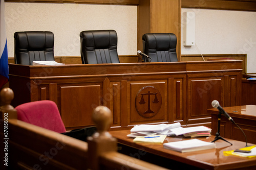 A courtroom in a Russian court, an empty judge's chair