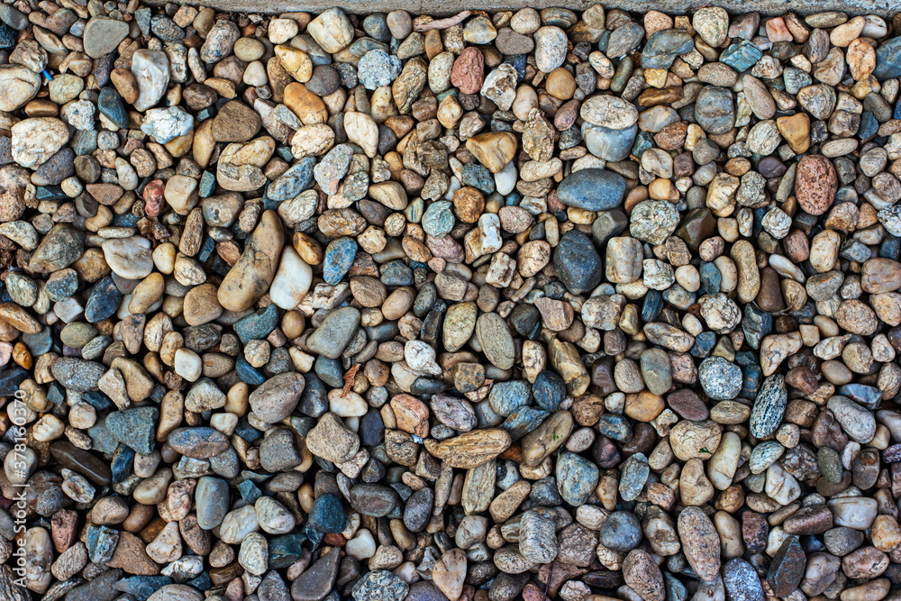 Pile of flat small colored mosaic of pebbles top view Pile of flat small colored mosaic of pebbles top view