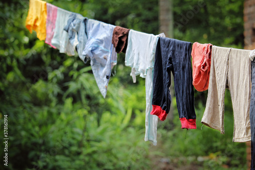 Clothes hanging on the line outside done.
