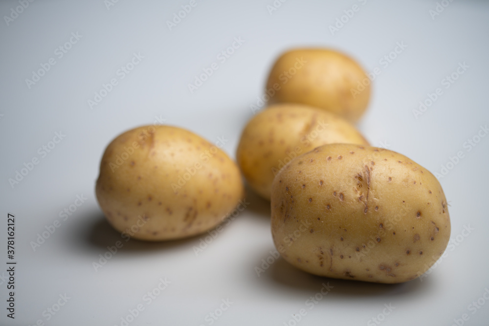 four raw potatoes flat lay four raw potatoes flat lay