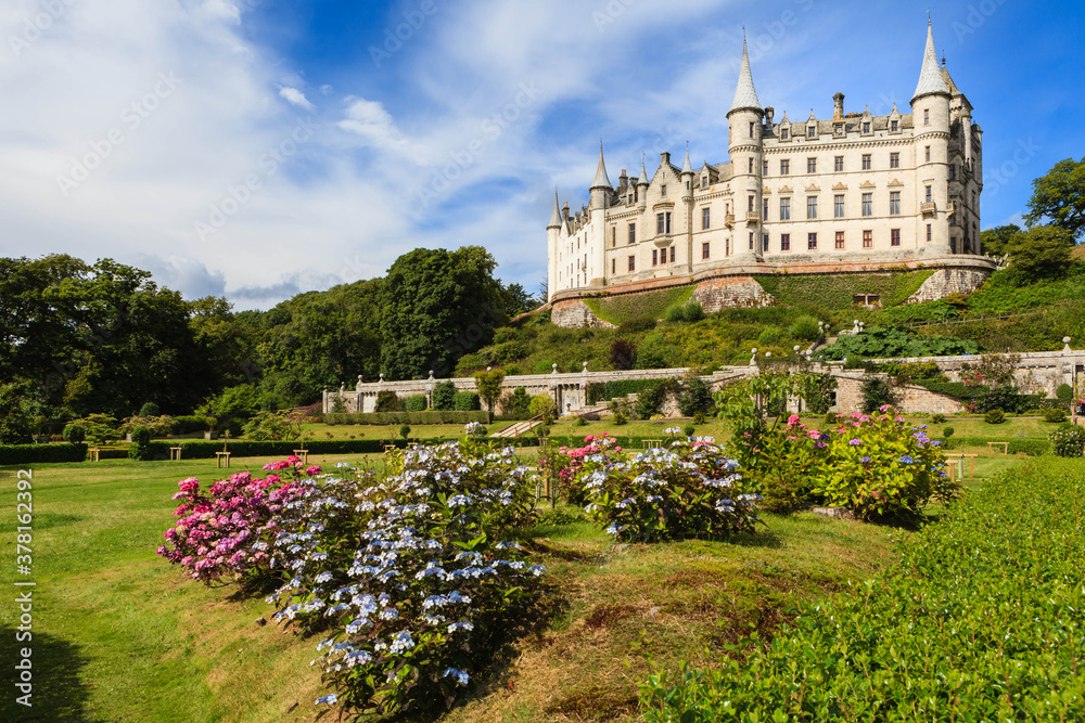 Dunrobin Castle photographed on a sunny day from its beautiful gardens