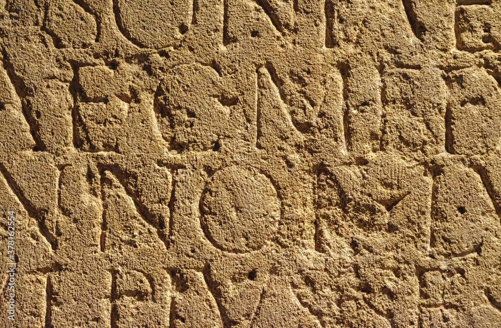 roman inscription in brown stone in bath, united kingdom roman inscription in brown stone in bath, united kingdom