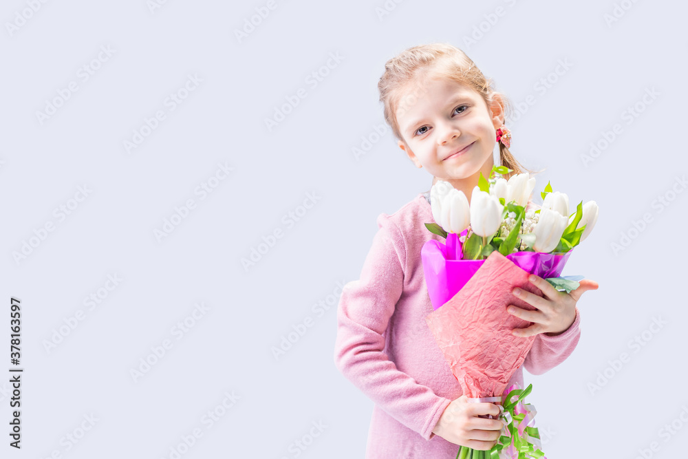 beautiful little girl with a bouquet of white tulips. beautiful little girl with a bouquet of white tulips.