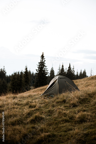 tourism  tourist tents on the background of the mountain  nature  hiking  people on a hike