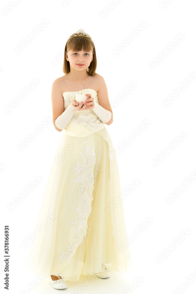Little girl in a New Year costume with a candle. Little girl in a New Year costume with a candle.
