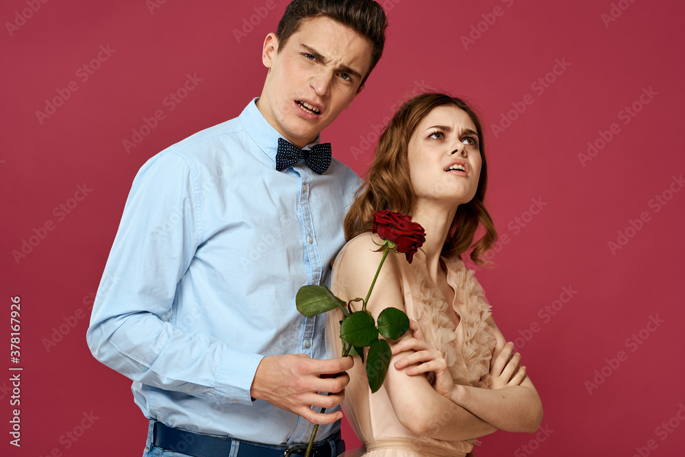 Lovers people with rose in hands on pink isolated background hug emotions happiness romance feelings