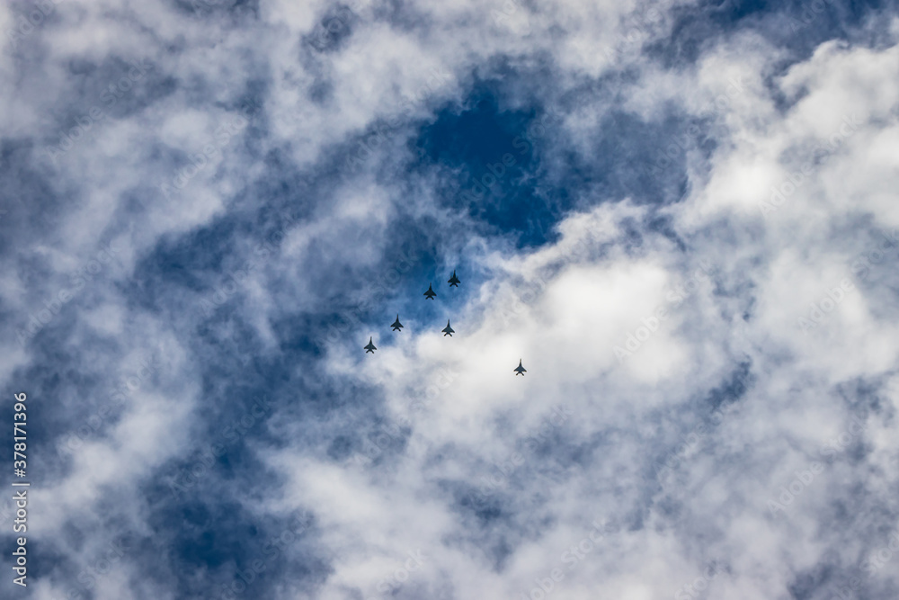 bright blue sky with jet fighter formation flying bright blue sky with jet fighter formation flying
