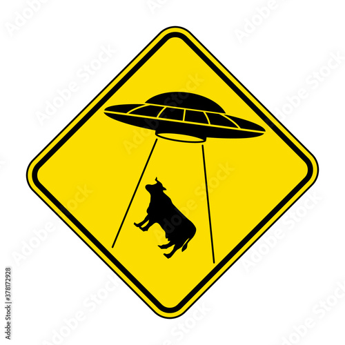 UFO abducts cow cattle from earth. Vector illustration of yellow diamond shaped warning road sign with alien abducts animal. Caution alien invasion in unidentified spaceship. Humorous traffic sign.