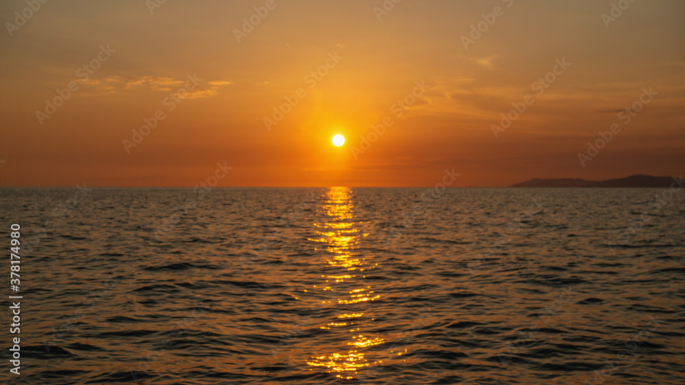 Beautiful abstract unfocused sunset over the sea. Blurry background for the screen saver. beautiful Wallpaper.