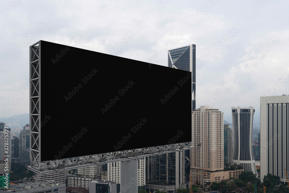 Blank black road billboard with Kuala Lumpur cityscape background at day time. Street advertising poster, mock up, 3D rendering. Side view. The concept of marketing communication. Blank black road billboard with Kuala Lumpur cityscape background at day time. Street advertising poster, mock up, 3D rendering. Side view. The concept of marketing communication.