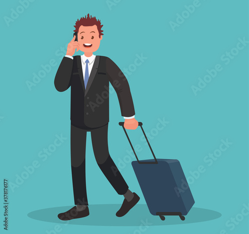 Business man at the airport with luggage is talking on the phone.