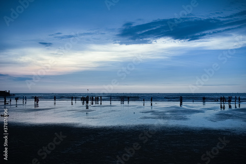 Evening cool look of Murudeshwara beach with dark blue sky and clouds rolling over the sea.