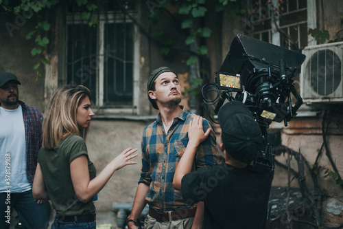 Operator with rig camera catch actors sight under street