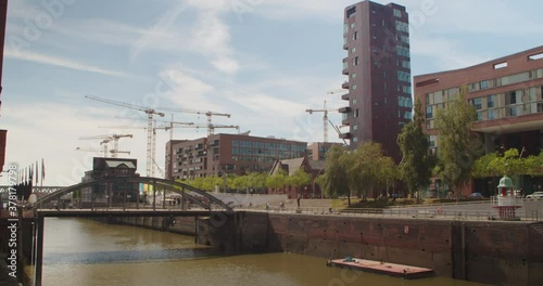 Hamburg, Germany. View from the bridge to the historic part of the city. View of Elbphilharmonie and Hafen City at sunset.