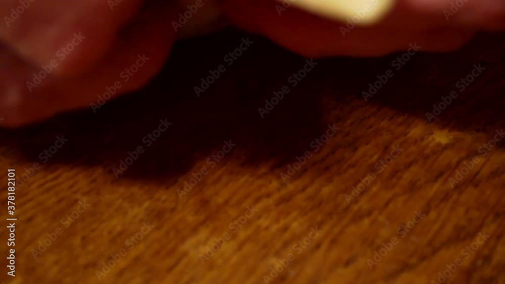 female hands work with dough on a wooden table.close-up. female hands work with dough on a wooden table.close-up.