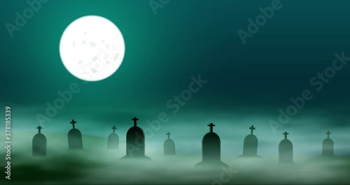 Mysterious cemetery in the night with billowing fog among the tombstones. A full moon illuminates the sky.