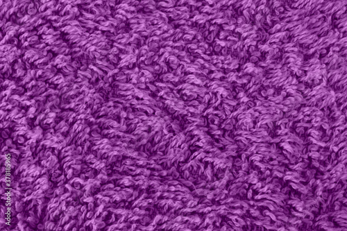 Extreme close up of the texture of a purple towel background