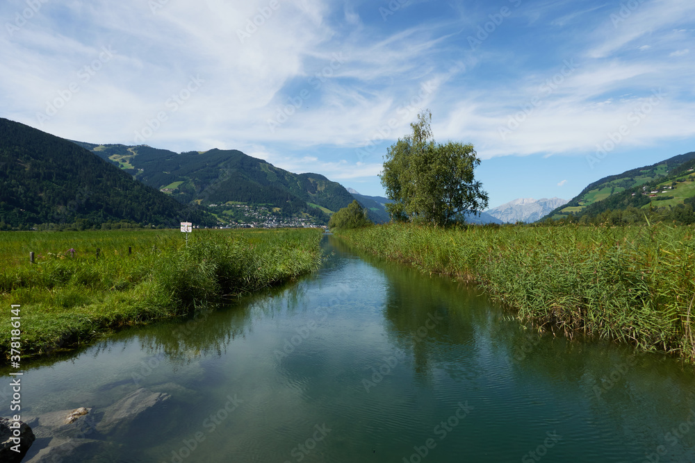 An ordinary stream in an alpine landscape in the middle of summer near Zell am See - August 25, 2020