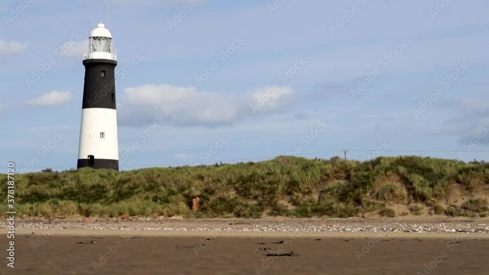 Composed Gliding Lighthouse with Bushes, sand and sky proportional Composed Gliding Lighthouse with Bushes, sand and sky proportional