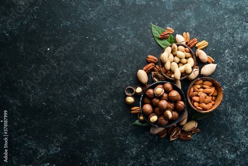 Set of nuts. Macadamia nuts, pecans, peanuts and almonds. Top view.