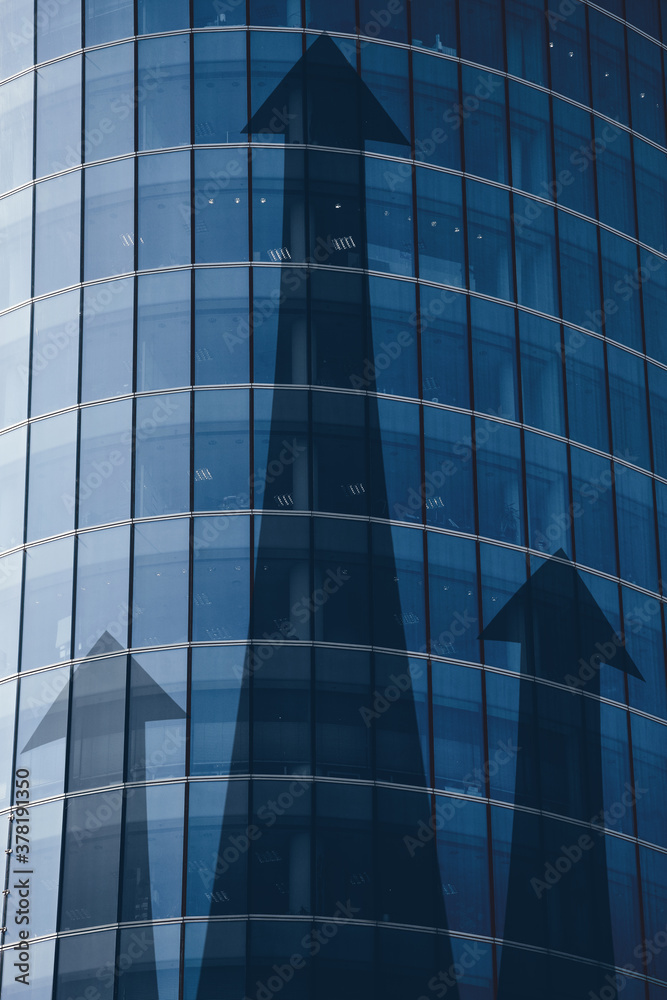 Fototapeta premium Business investment growth concept with abstract arrows on building