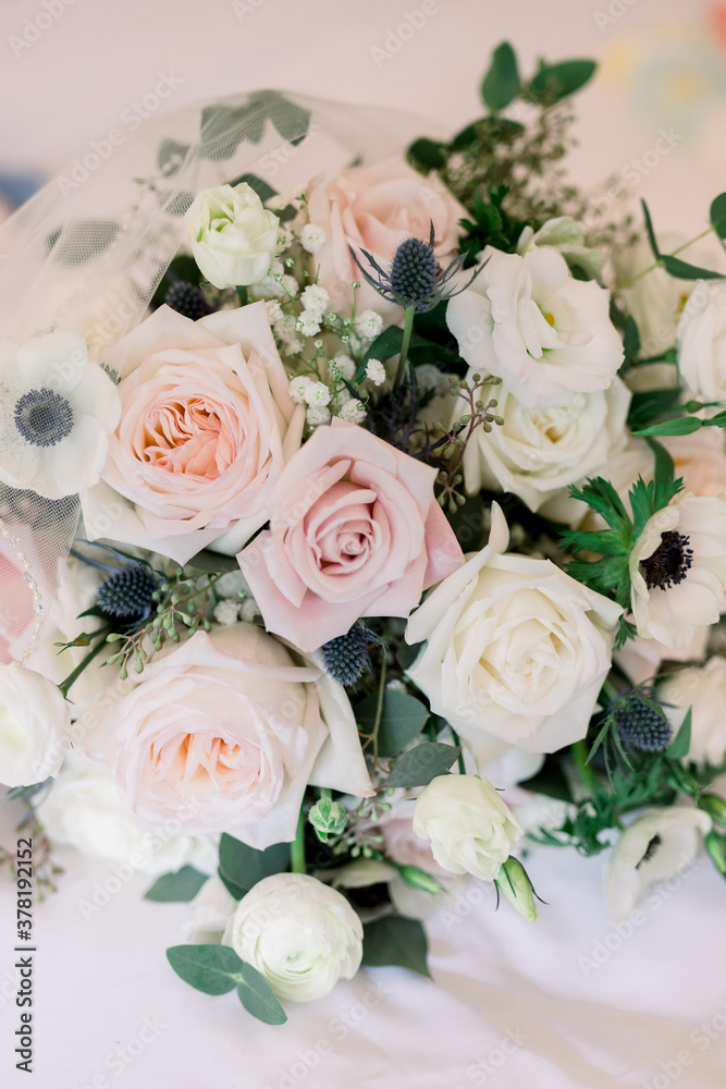 Wedding flower arrangement in hues of pink, mauve, white roses Wedding flower arrangement in hues of pink, mauve, white roses