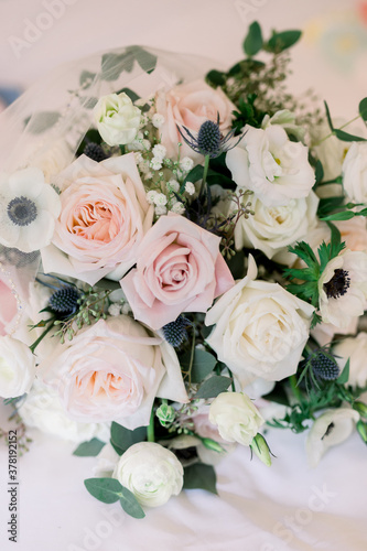 Wedding flower arrangement in hues of pink, mauve, white roses © DPN