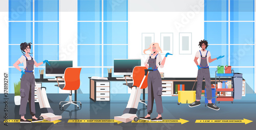 professional cleaners janitors team cleaning and disinfecting floor to prevent coronavirus pandemic modern office interior horizontal full length vector illustration