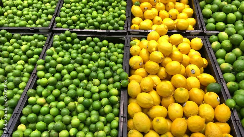 lemons and limes fruits piled at the market lemons and limes fruits piled at the market