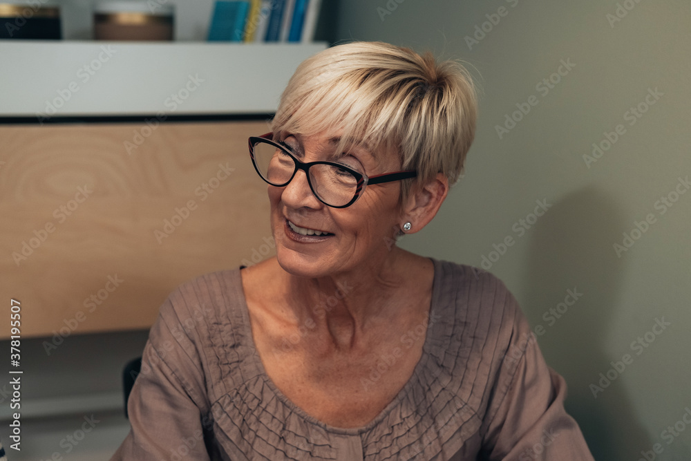 Portrait of cheerful mature woman smiling stock photo Portrait of cheerful mature woman smiling stock photo