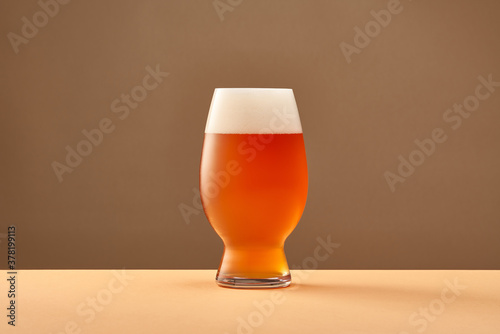 Glass of cold amber ale photo