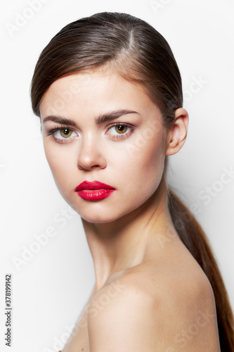 Beautiful woman red lips bared shoulders long hair 