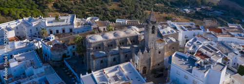Aerial drone image of a white andalusian town in south Spain with church