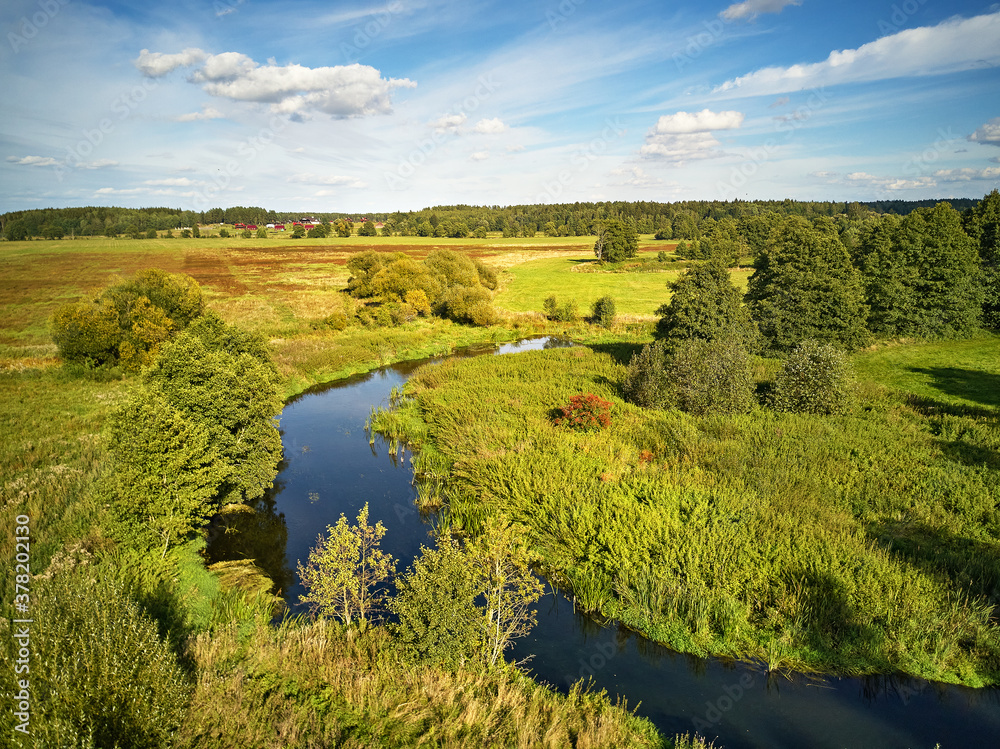 Sunny September day. Autumn landscape in evening sunlight from above.